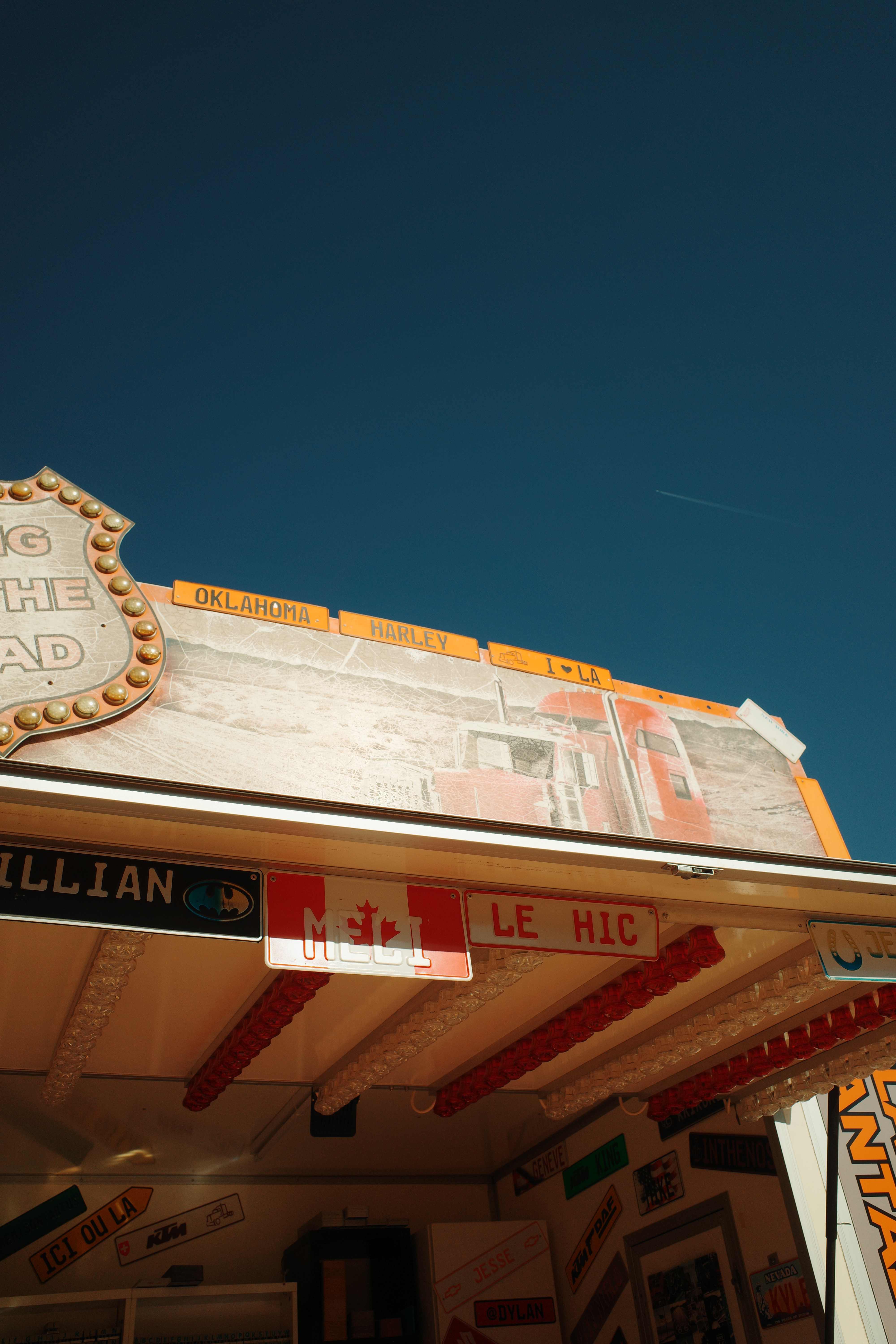 Theme-park stall under deep blue sky