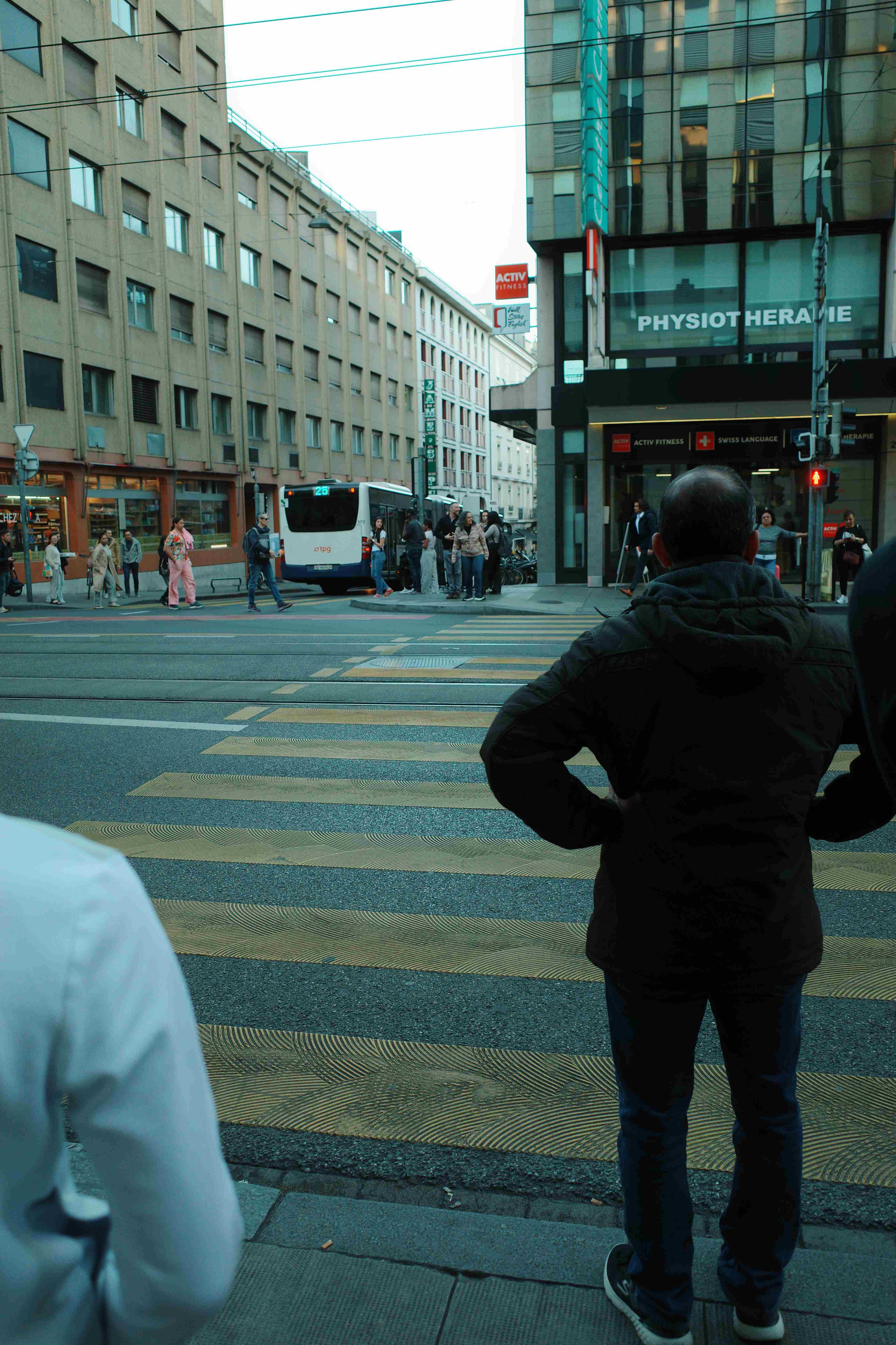 Man waiting at a crosswalk