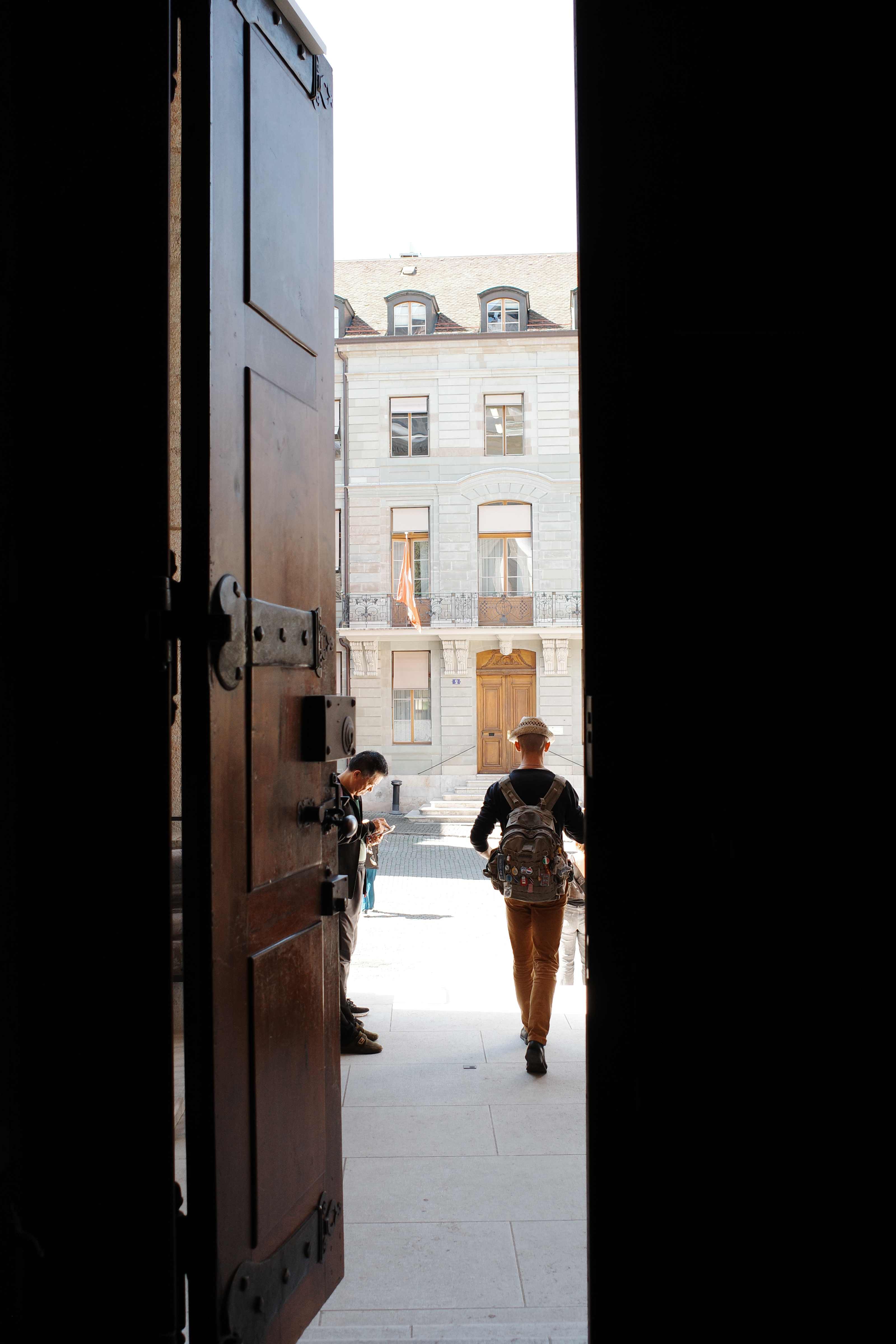 Doorway opening onto a bright courtyard